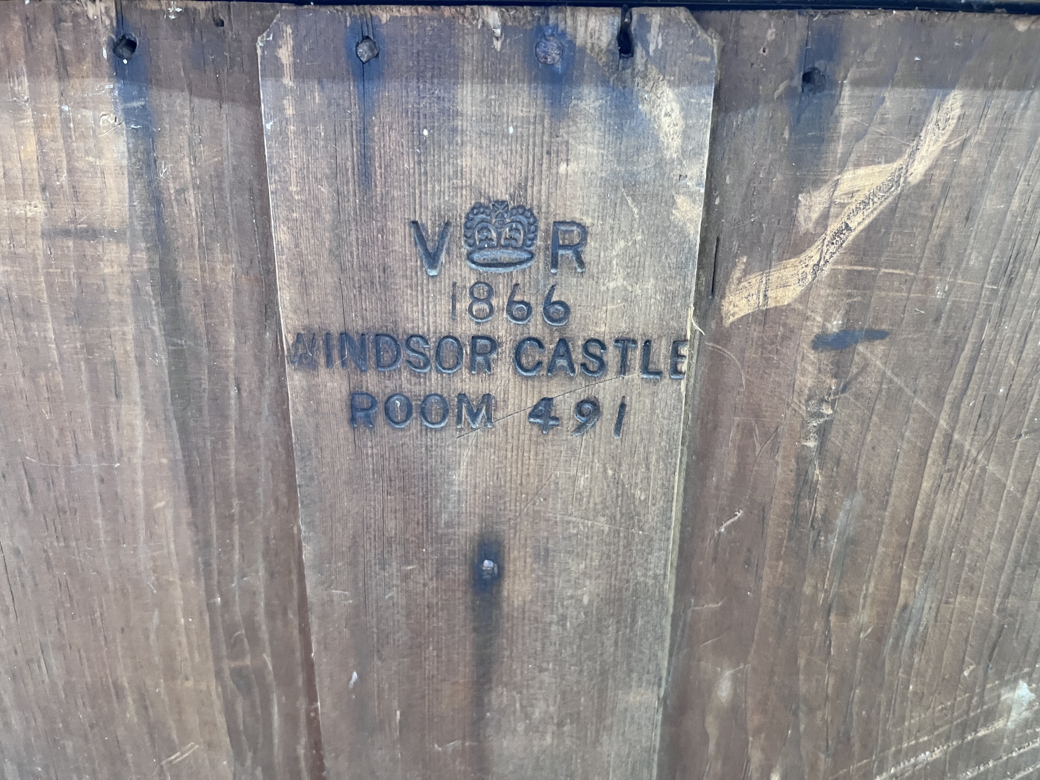 Royal interest - A Victorian pine chest marked with the Royal Cypher dated 1866 Windsor Castle Room 491, width 106cm, depth 53cm, height 89cm